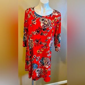 Very nice fitting dress color red with a floral pattern